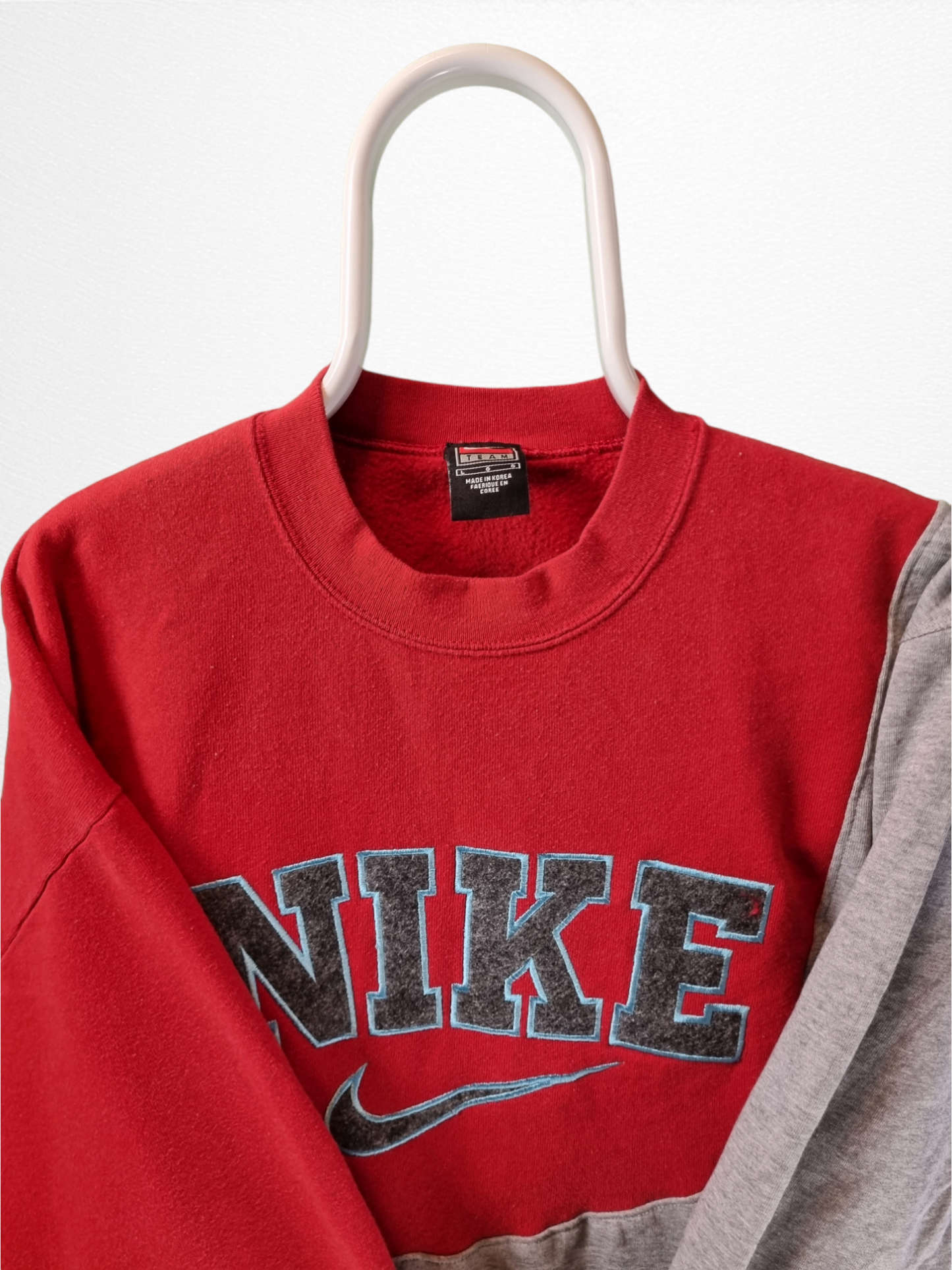 Nike reworked spell  out sweater maat M